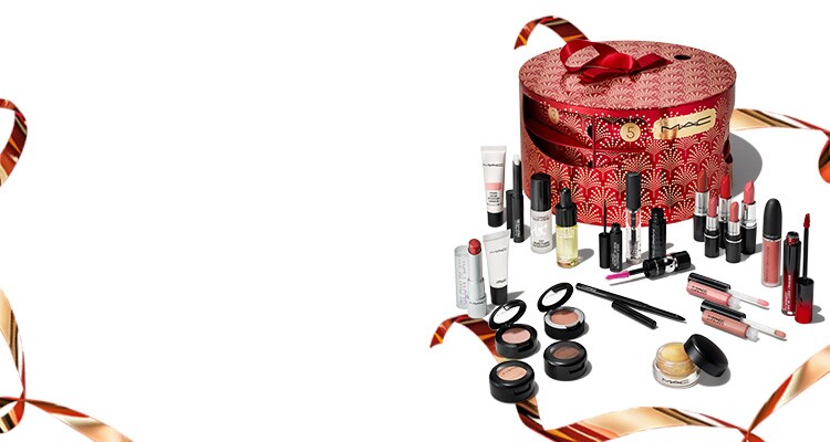 The MAC Advent Calendar is back, worth £405, yours for £165. Visual of advent calendar with gold ribbons and all products 